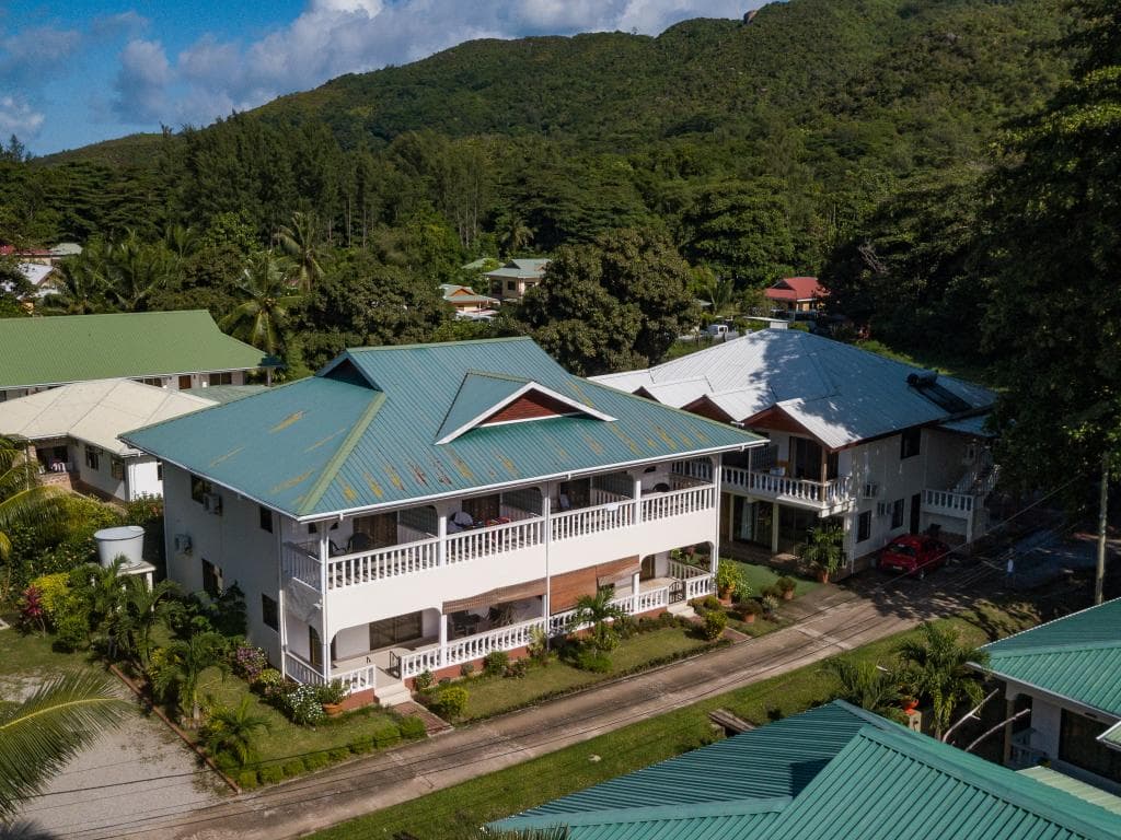Tourterelle Holiday Home building surrounded by palm trees